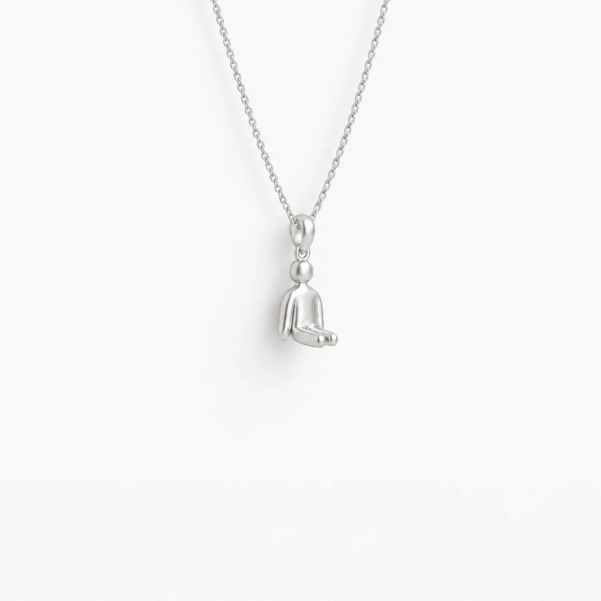 Stillness Figure Pendant in 925 sterling silver, hanging from a fine chain