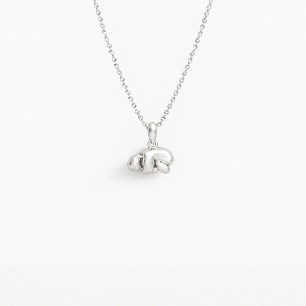 Curled-up Figure Pendant in 925 sterling silver, hanging from a fine chain