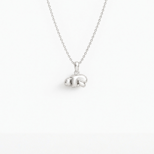 Curled-up Figure Pendant in 925 sterling silver, hanging from a fine chain