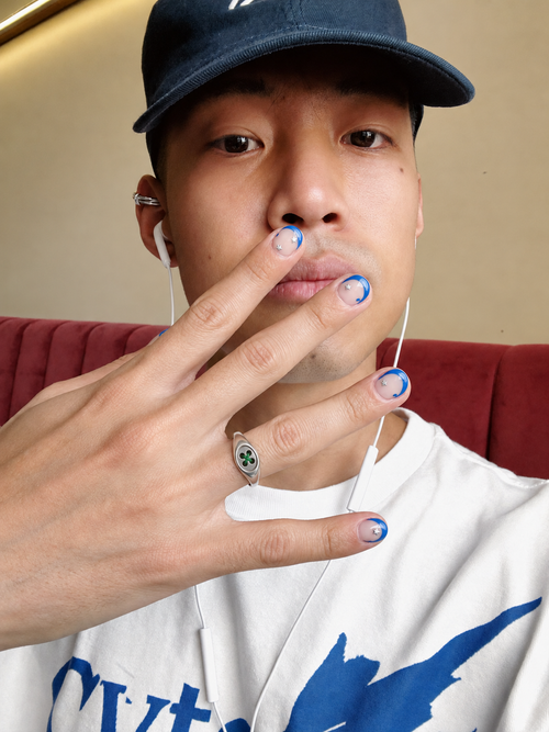 The Button Signet Ring worn on the hand