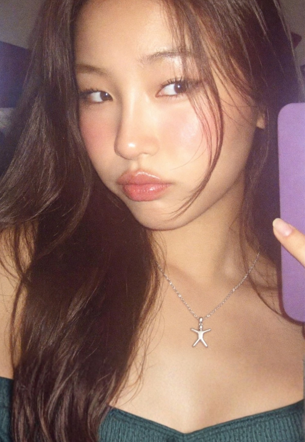 A model wearing the Joyful Spirit Pendant on a fine silver chain