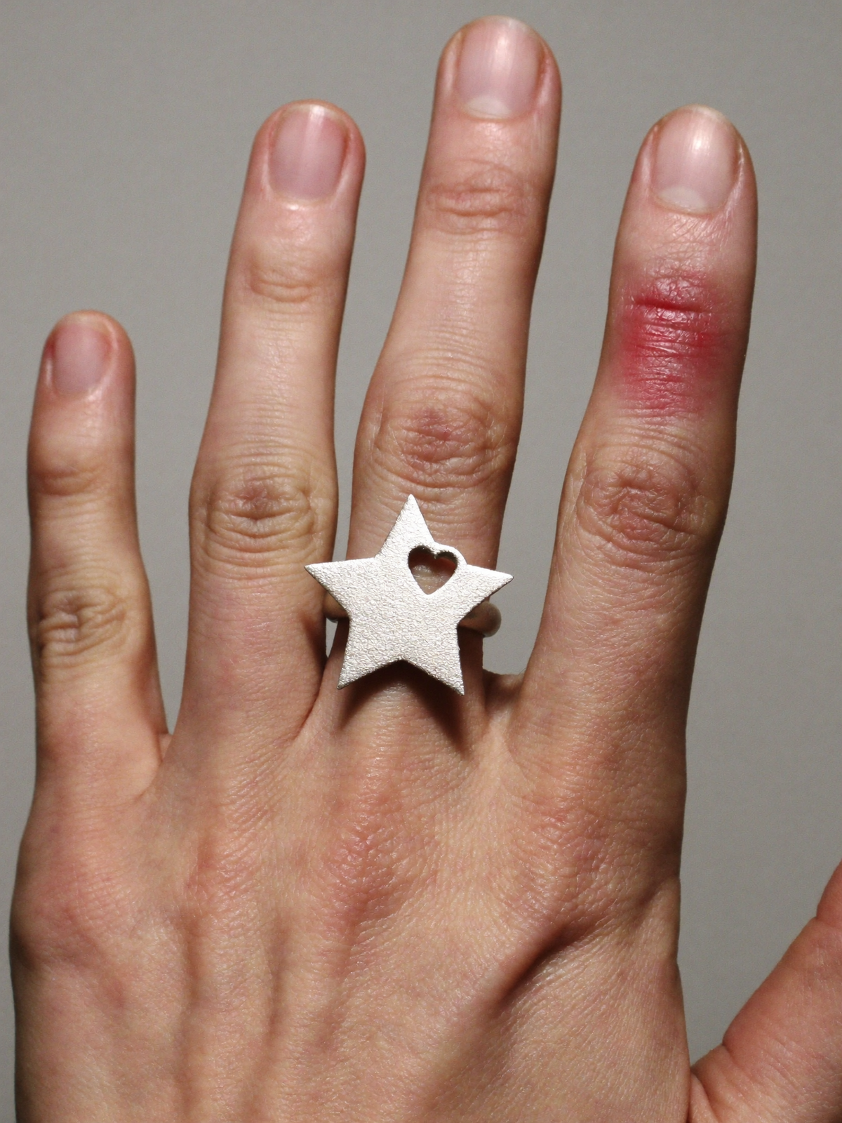 The Star Ring worn on the hand