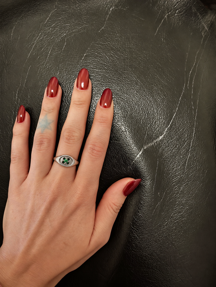 The Button Signet Ring worn on the hand