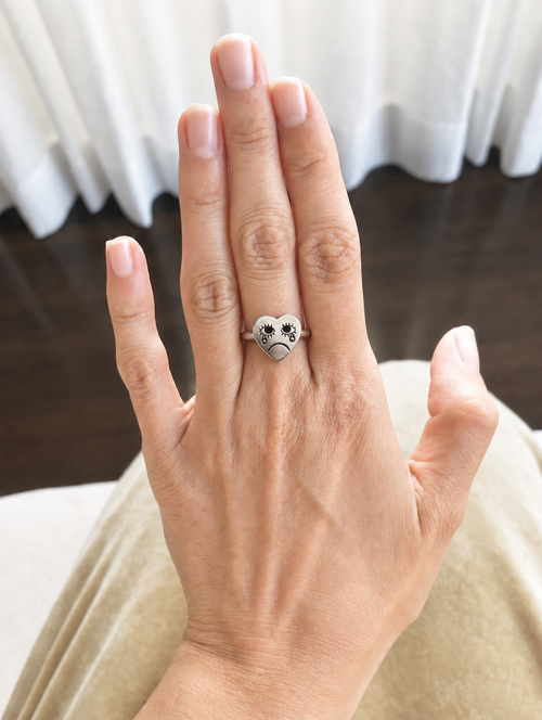 The Crying Heart Ring worn on the hand